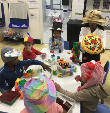 group of children playing in the table