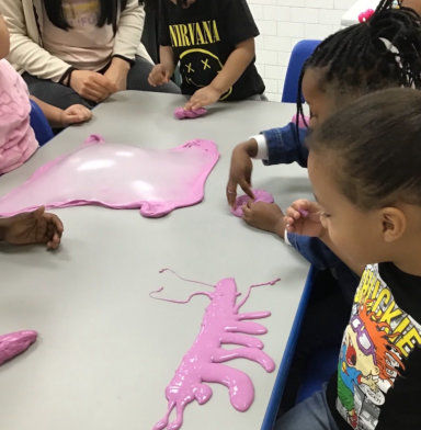 group of kids playing clay