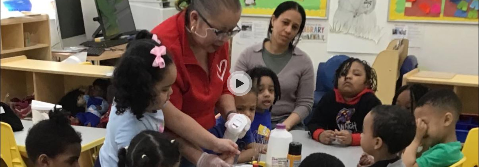 female teacher teaching kids