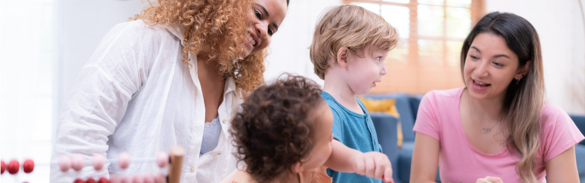 two female teacher teaching little kids