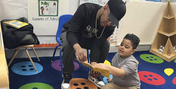 female teacher smiling with kids