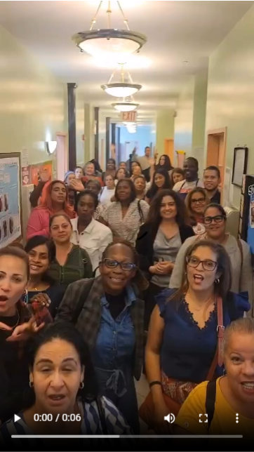 man with group of kids smiling