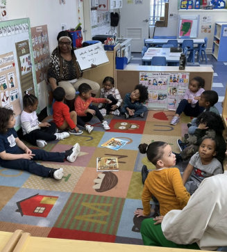 elderly teacher teaching little kids