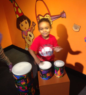 a kid playing drum