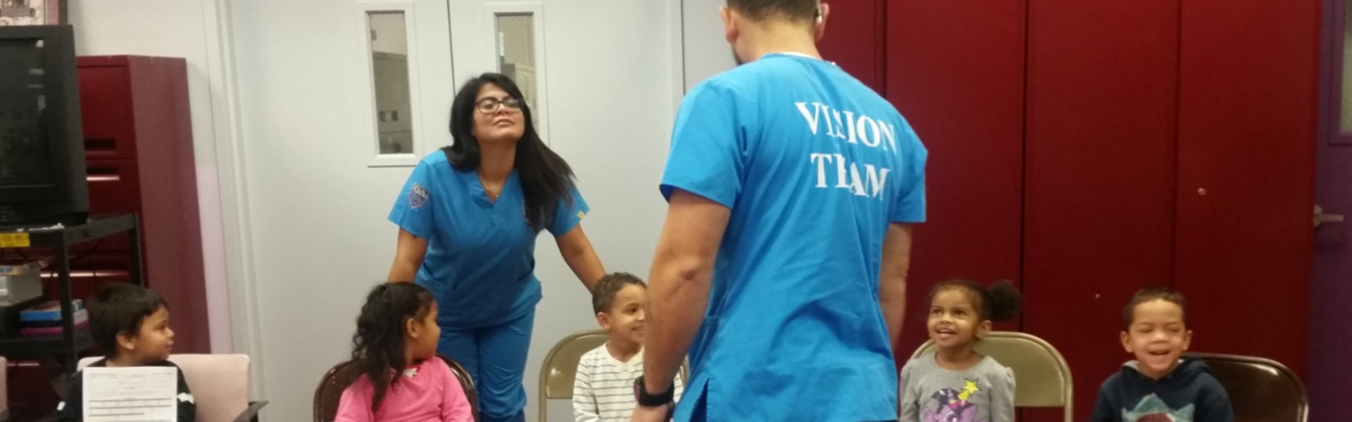 man and woman talking with kids