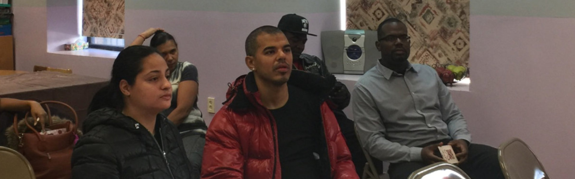 parents sitting and listening to announcements