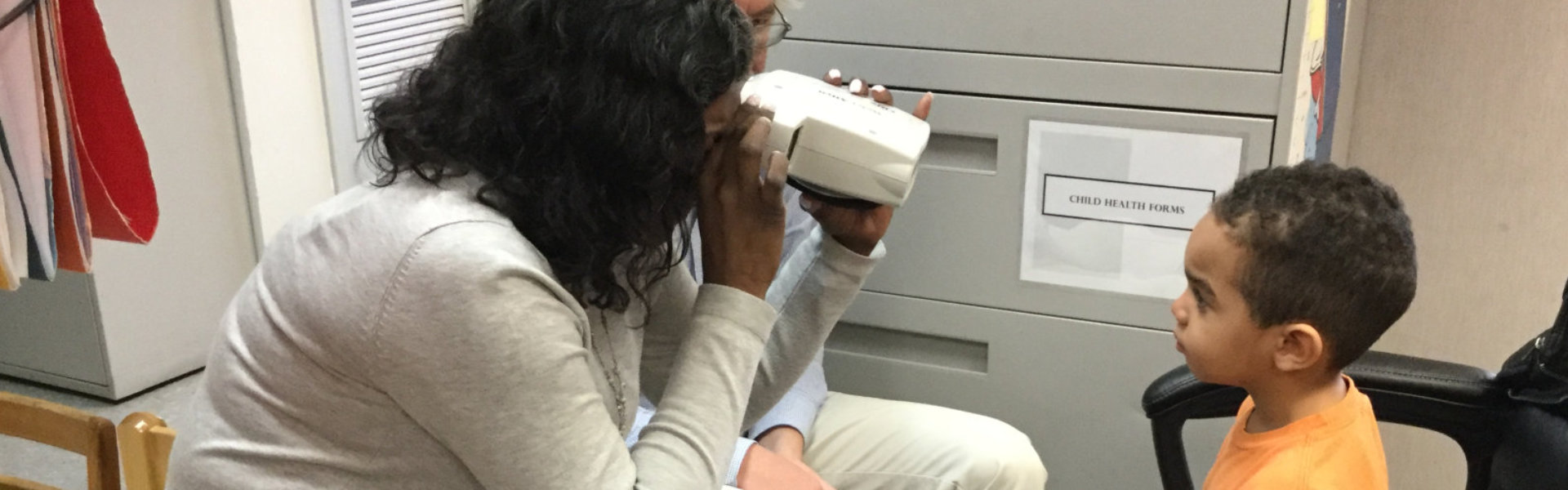 woman capturing a little boy