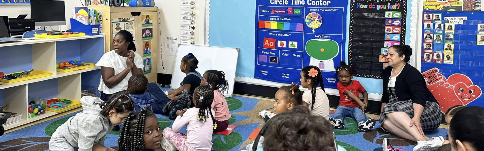 kids listening to female teacher
