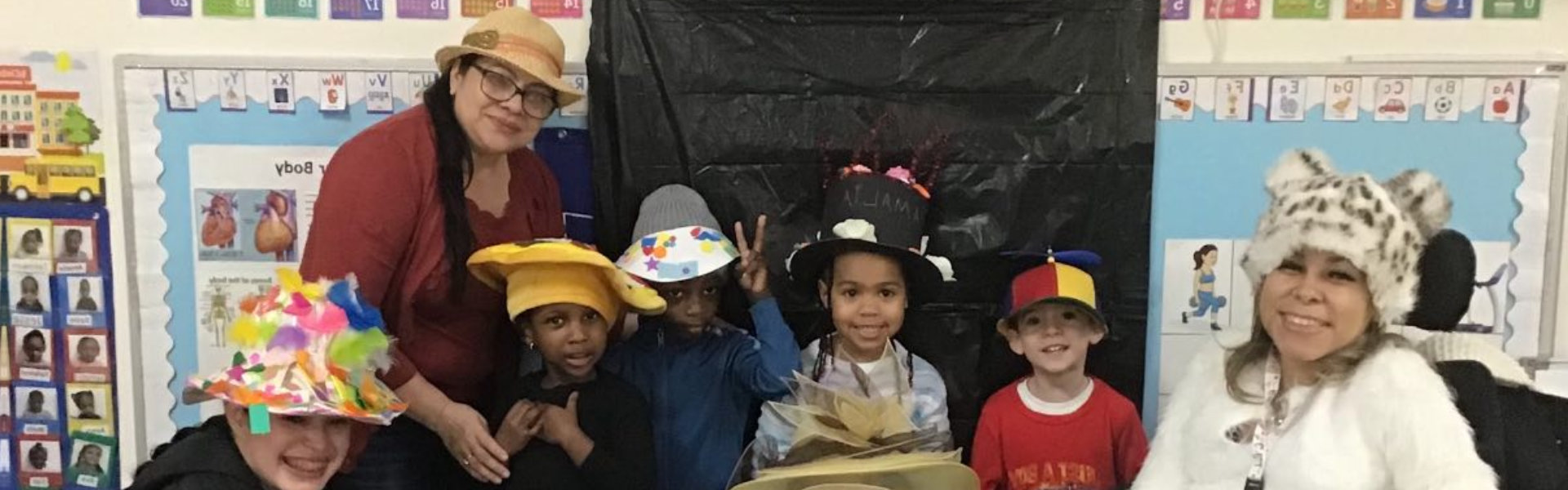 female teachers with kids smiling